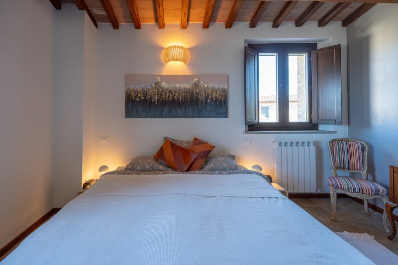 Bedroom with exposed wooden beams